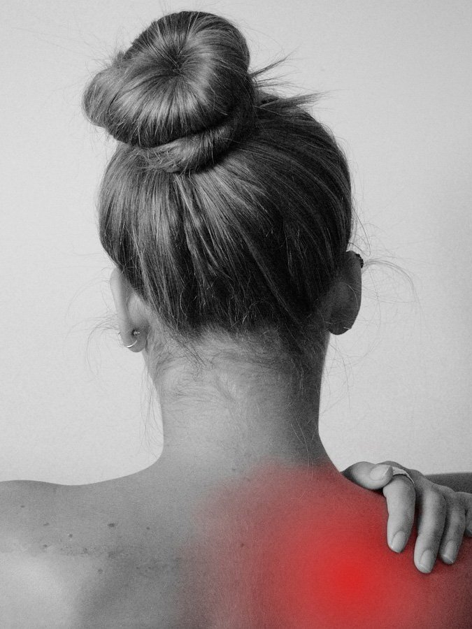 Woman with upper back pain