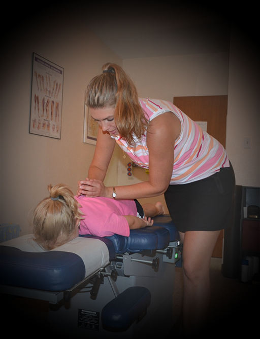 Dr. Whitney providing chiropractic care